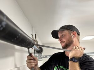 Broken garage door torsion spring replaced by Stapley Action Garage Door in Mesa, AZ